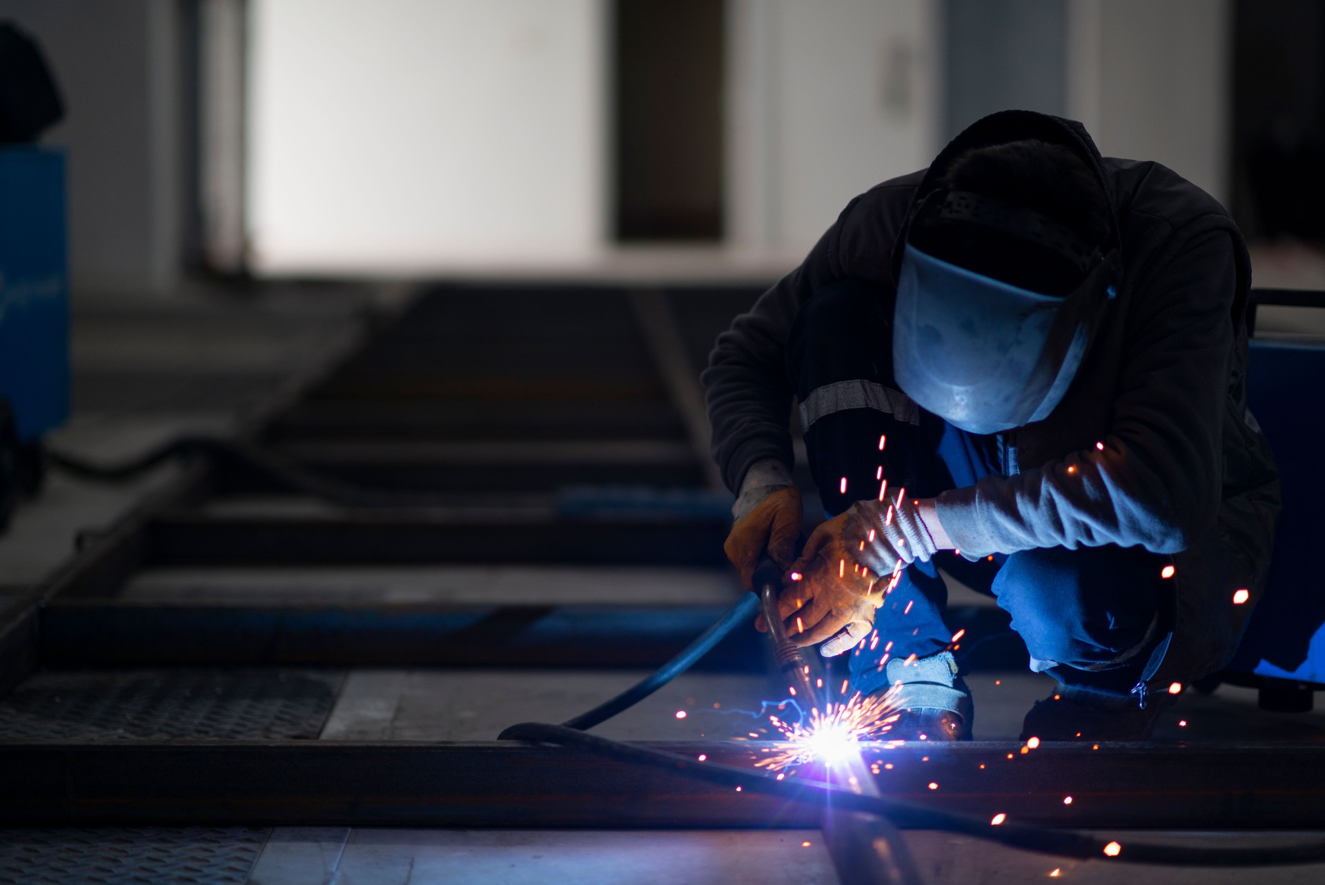 A worker is doing gas welding